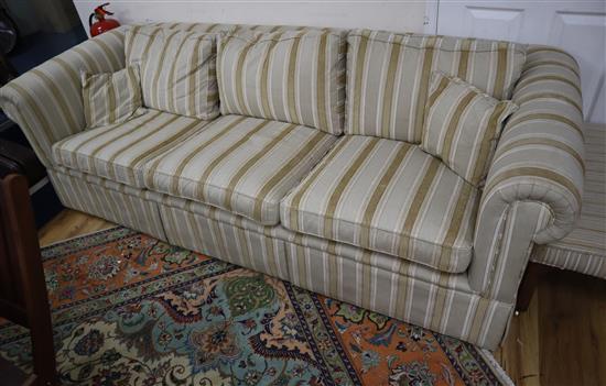 A three seater Chesterfield settee upholstered in striped fabric W.226cm